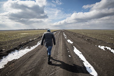 Farm administrator Svitlana Sirko walks on her farm in the Odessa Oblast. Ukraine produces almost 12% of the wheat in the global export market.
