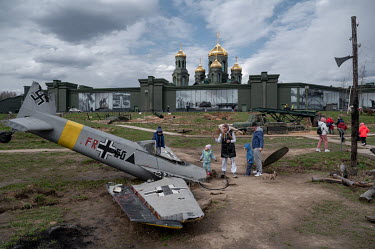 People climb on a Nazi aeroplane at Park Patriot in Moscow.