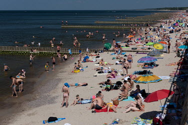 Tourists relax on a beach on the Baltic Sea in Zelenogradsk.