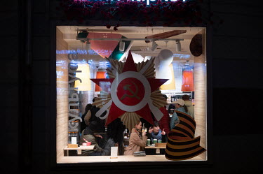 A cafe window decorated for the Victory Day.