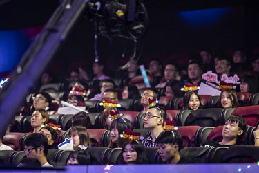 E-gaming sit in an E-game arena before the start of a match.