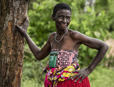 A woman at the sanctuary of Kaya Godhoma, a refuge which provides refuge to those accused of witchcraft built on holy ground near the remote village of Mrima wa Ndege, who looks after those accused of...