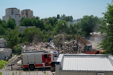 Municipal services clearing the site where two residential houses, at the intersection of Popov and Mayakovsky streets, were destroyed by an explosion on the night of 3 July 2022 which the Russian aut...