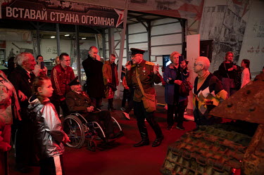 Veterans of the Second World War on an excursion in the exhibition centre of military equipment of the Patriot Park.