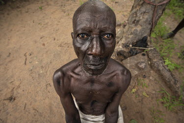 A man who has been accused of being a witch, undergoing a ritual cleansing to allow him to be reintegrated into his community, at the village of Kaya Godhoma, a refuge which provides sanctuary to thos...