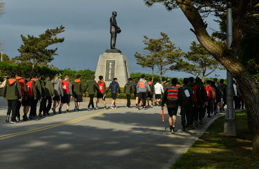 National Service conscripts march past a statue of former ROC Generalissimo Chiang Kai-shek on Dongju islet. Frontline Dongju is part of the Matsu archipelago that is Taiwanese territory, but lies jus...