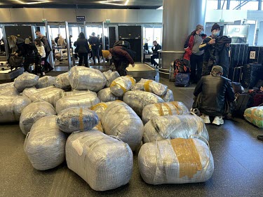 Luggage in the departures hall at a Moscow airport. In the aftermath of Russia's invasion of Ukraine many Russian citizens fled overseas and as a result tickets for flights to the few remaining countr...