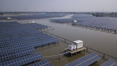 Photovoltaic panels in a lake at an aqua solar farm. China is the world's largest solar power producer.