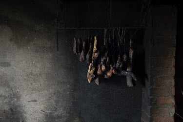Dried smoked meat hung up in a home in Baijie township.