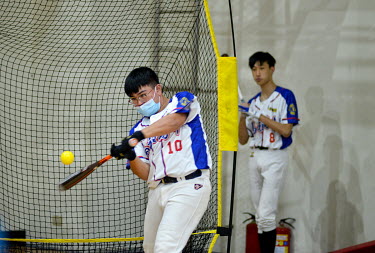 Baseball practise at Matsu Senior High School on Nangan Island. Baseball was introduced here by US military advisers based on Matsu in the 1960s, but these days most of the flat ground, on famously mo...
