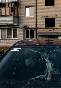 A car with a letter 'Z' sticker on the windscreen which has been shattered by a Tochka-U rocket explosion which the Russian authorities claim was fired from Ukraine.