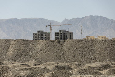 New apartment buildings stand in the Gobi desert in Golmud. Golmud, the third largest city on the Tibetan plateau, is developing as a key Chinese military staging point for nearby the autonomous regio...