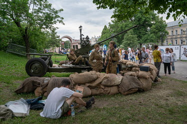 People take part in Russia Day (Unity Day) events and reenactments on June 12 in Moscow.