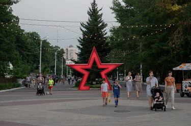 The streets of Belgorod are decorated with red stars and Russian flags.