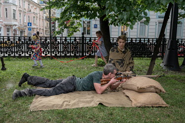 People take part in Russia Day (Unity Day) events and reenactments on June 12 in Moscow.