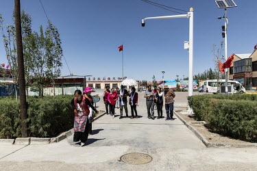 Visitors walk through a showcase Tibetan village in Golmud. Golmud, the third largest city on the Tibetan plateau, is developing as a key Chinese military staging point for nearby the autonomous regio...