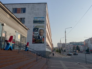 Portraits of Putin and his quotes about the Russian world displayed on the main street in Belgorod.