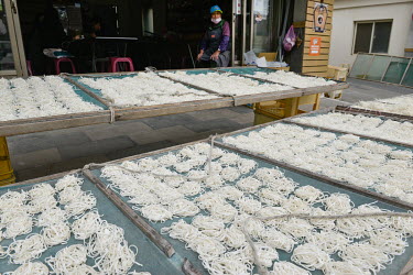 Traditional fish noodles drying in the sun in front of a restaurant in Tangchi, the main settlement on Beigan Island, part of the Matsu archipelago, a frontline island group belonging to Taiwan that l...