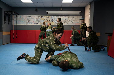 Children train at the military-patriotic club 'Sova'. This is an additional education facility for children aged from 10 to 18 years old. They learn the basics of military training, self-defence techn...