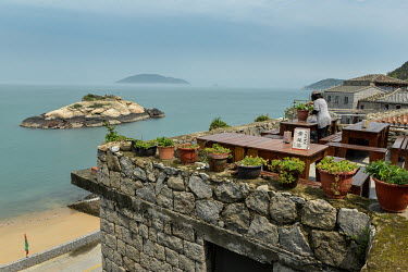 The distinctive 'Turtle Rock' in the bay of the ancient and well-preserved traditional Fujianese village of Qinbi, nowadays a magnet for domestic Taiwanese tourism.