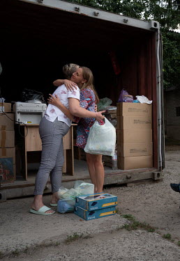 Yulia (R), a volunteer with the Decimal Circle organisation, which provides assistance to refugees from Ukraine. Yulia collects food and household kits . Each set is designed to last for 2-3 weeks. Si...