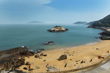 The distinctive 'Turtle Rock' in the bay of the ancient and well-preserved traditional Fujianese village of Qinbi, nowadays a magnet for domestic Taiwanese tourism. Mainland China's Fujian Province ca...
