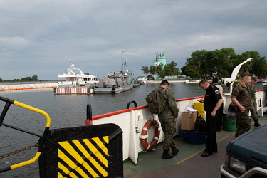 Servicemen are transported by ferry from Baltiysk to the Baltic Spit.