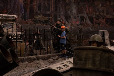 A boy explores the three-dimensional diorama, 'Koenigsberg-45. The Last Storm' on display in the Kaliningrad Regional Museum of History and Art.