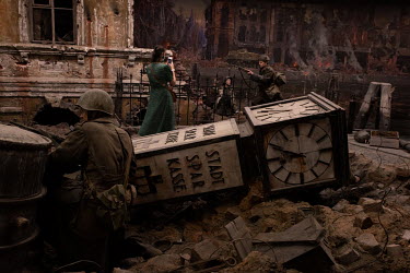 A woman explores the three-dimensional diorama, 'Koenigsberg-45. The Last Storm' on display in the Kaliningrad Regional Museum of History and Art.
