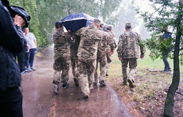Soldiers carry the coffin of Anton Viktorovych Savytskyi (43) during his funeral. Anton was killed fighting against Russian forces on 7 August 2022 in Bakhmut, Donetsk region. He left behind a wife an...
