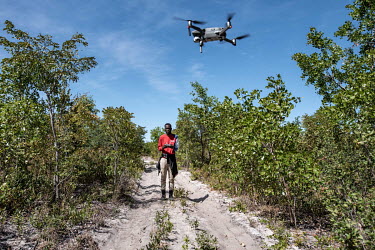 Drone operator Pedro Afonso Pacheco launches a drone during a survey of a suspected minefield.