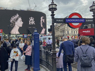 A giant image showing the young and elderly Queen Elizabeth II displayed in Piccadilly Circus following her death in Scotland on the 8 September 2022 at the age of 96.