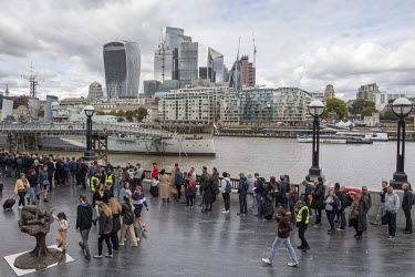 A queue of people wait in line to pay their final respects to Queen Elizabeth II, following her death on 8th September 2022. The queue stretched up to 10 miles along the South Bank of the Thames in Lo...