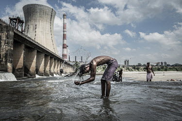 Locals wash, fish and play in the shadow of the Bokaro Thermal Power Plant on the Konar River, a tributary of the Damodar.Experts say river pollution poses a grave threat to India's health and prosper...