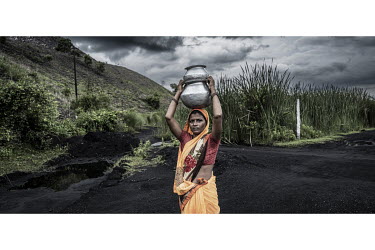 Sonia Devi (30) lives in the hamlet of Kathara Washery Basti, where residents walk for several kilometres to the Damodar River to collect water for drinking, washing and cooking. Experts say river pol...