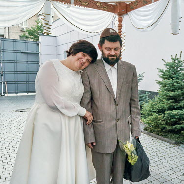 Orthodox Jewish bride, Bella, and groom Dan getting married beneath a chuppah (canopy) at the Menorah centre.