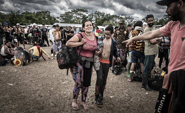 Nearing the end of her ordeal in the jungle an exhausted Venezuelan woman stands in line the Canaan Membrillo migrant processing centre.The Darien Gap is the missing link in the 17,000-mile Pan-Americ...