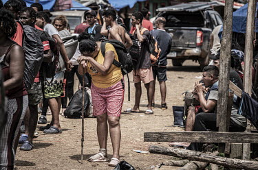 Migrants arrive in the relative safety of Puerto Limon, a makeshift dock on the banks of the Chucunaque River where a steady stream of canoes drop off exhausted migrants recently-emerged from the jung...
