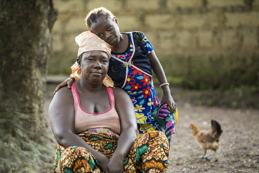 Margaret Kamara (39) and her seven-year-old daughter Mariattu both contracted but survived Ebola. 15 of Margaret Kamara's relatives, including her husband and four children, died during an ebola outbr...