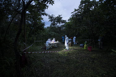 Scientists prepare samples taken from animals collected as part of USAID Predict project looking for new viruses in the wild animal population.