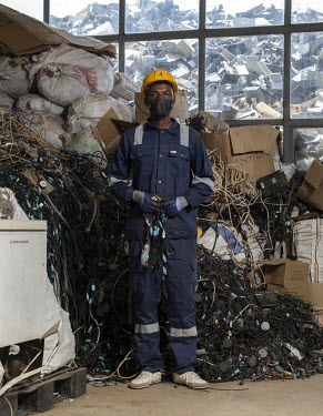 A dismantling line worker at EnviroServe Rwanda Green Park where valuable elements contained in e-waste are separated from the hazardous ones. It is the only state-of-the-art facility in East Africa c...