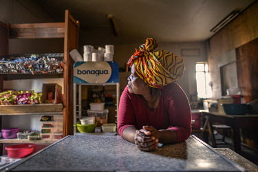 Nombulelo Mdunyelwa (54) waits for customers at her tuck shop in Ahmed Kathrada House, an abandoned nursing home in inner city Cape Town that is now being occupied by several hundred people. Nombulelo...