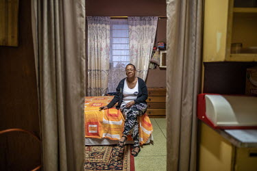 Elizabeth Daniels, 52, in her room at Cissie Gool House, an abandoned hospital in the Woodstock neighbourhood of Cape Town now occupied by over 1,000 people. Before moving here, Daniels' family had be...
