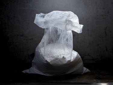 A plastic bag containing a kilogram (2.2 pounds) of 100% pure, uncut cocaine which is sold for around USD 1250 but has a street value of around USD 127 per gram in London.