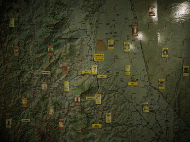 A map with photographs of more than thirty 'Capos' (drug bosses) cover a military map of the Catatumbo region. Each accused controls a slice of territory, and the army's job is simple: destroy, captur...