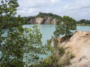 A lake fills an abandoned open coal mine in Makroman. According to the NGO Mining Advocacy Network Jatam, 40 people, mostly children, have died since 2011 due to abandoned mine pits that were not refi...