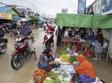 Market day on the main street of Sepaku, near the site where the new Indonesian capital Nusantara will be built.In 2019, President Widodo announced the plan to move the Indonesian capital from Jakarta...