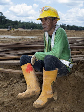 A worker at the construction site of a nursery where trees will be grown for the new Indonesian capital Nusantara.In 2019, President Widodo announced the plan to move the Indonesian capital from Jakar...
