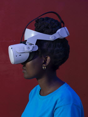 A gamer using a virtual reality headset in a VR gaming room.