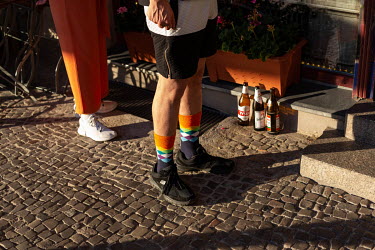 Hamoudi wearing socks in the colours of the rainbow flag.Returning to his native Raqqa in 2011, where he lived the first 18 years of his life, to join anti-regime protests, Hamoudi and friends came to...